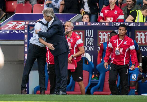 Manuel Pellegrini manager of Manchester City and Alan Pardew Manager of Crystal Palace shake hands and embrace after the Barclays Premier League match between Crystal Palace and Manchester City at Selhurst Park, London, England on 12 September 2015. Copyright: xLiamxMcAvoyx 05870059