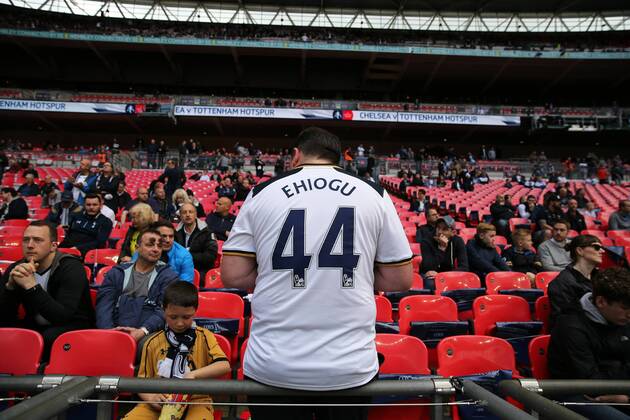 April 22nd 2017, Wembley Stadium, London England; Emirates FA Cup semi-final Chelsea versus Tottenham Hotspur; Spurs fan wearing home shirt with Ugo Ehiogu on the back in Tribute on the big screen outside Wembley Stadium to former Aston Villa and England International Ugo Ehiogu who passed away yesterday xJohnxPatrickxFletcherx  ActionPlus11870749