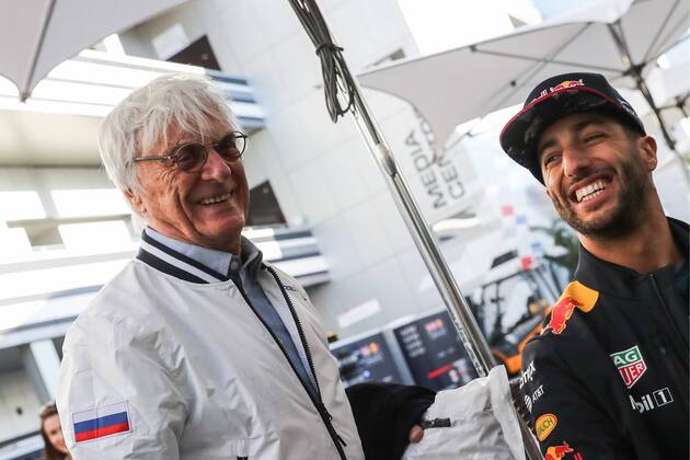 SOCHI, RUSSIA - APRIL 27, 2017: Bernard Charles Bernie Ecclestone (L), president of the Formula One Management and Formula 1 Administration (FOA), and Australian driver Daniel Ricciardo of the Red Bull Racing F1 Team talking in a paddock at the Sochi Autodrom racing circuit ahead of the 2017 Formula One Russian Grand Prix. Vyacheslav Prokofyev TASS  TS049E72