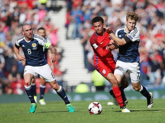 Scotland s Stuart Armstrong tussles with England s Dele Alli during the FIFA World Cup WM Weltmeisterschaft Fussball Qualifying match at Hampden Park Stadium, Glasgow Picture date 10th June 2017. Picture credit should read: David Klein Sportimage EDITORIAL USE ONLY. No use with unauthorised audio, video, data, fixture lists, club league logos or live services. Online in-match use limited to 120 images, no video emulation. No use in betting, games or single club league player publications.