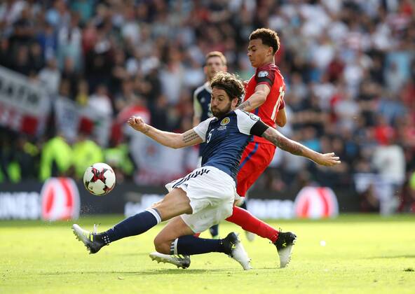 Scotland s Charlie Mulgrew tussles with England s Dele Alli during the FIFA World Cup WM Weltmeisterschaft Fussball Qualifying match at Hampden Park Stadium, Glasgow Picture date 10th June 2017. Picture credit should read: David Klein Sportimage EDITORIAL USE ONLY. No use with unauthorised audio, video, data, fixture lists, club league logos or live services. Online in-match use limited to 120 images, no video emulation. No use in betting, games or single club league player publications.