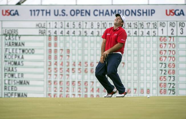 Patrick Reed reacts to missing a putt on the 18th green during round 3 of the 117th U.S. Open golf tournament at Erin Hill golf course on June 17, 2017 in Erin, Wisconsin.  WIS20170617301 KEVINxDIETSCH