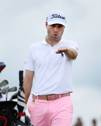 Justin Thomas reacts after making a birdie putt on the 8th hole during round 3 of the 117th U.S. Open golf tournament at Erin Hill golf course on June 17, 2017 in Erin, Wisconsin.  WIS20170617102 BRIANxKERSEY