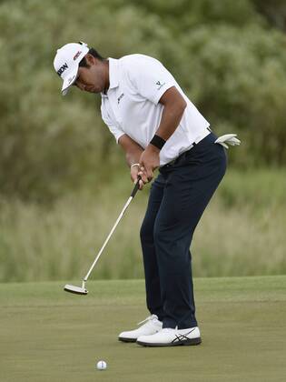 Hideki Matsuyama of Japan misses a birdie putt attempt on No. 1 but manages par during the final round of the 117th U.S. Open golf tournament at Erin Hill golf course on June 17, 2017, in Erin, Wisconsin.  WIS20170618520 BRIANxKERSEY