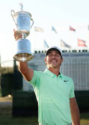 Brooks Koepka poses with the U.S. Open Trophy after the final round of the 117th U.S. Open golf tournament at Erin Hills golf course on June 18, 2017 in Erin, Wisconsin. Koepka shot a 16-under 272 to win the tournament by 4 strokes.  WIS20170618102 BRIANxKERSEY