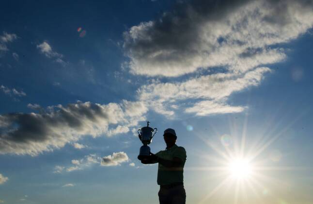 Brooks Koepka poses with the trophy after winning the 117th U.S. Open golf tournament at Erin Hills golf course on June 18, 2017, in Erin, Wisconsin. Koepka posted a final score of 16-under-par.  WIS20170618311 KEVINxDIETSCH