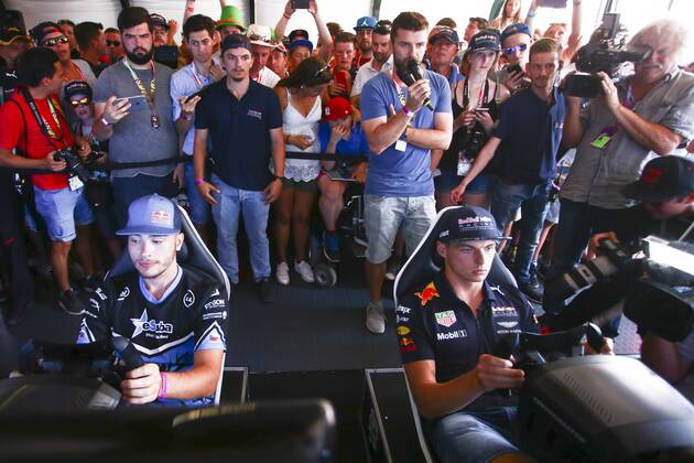 FORMULA 1 - GP of Austria 2017 SPIELBERG,AUSTRIA,07.JUL.17 - MOTORSPORTS, FORMULA 1 - Grand Prix of Austria, Red Bull Ring, free practice. Image shows Max Verstappen (NED Red Bull Racing) and Red Bull eGamer hakkiJunior Erik Lestach. GEPAxpictures xFelixxRoittner