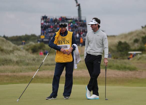 American Bubba Watson chats with his caddy on the seventh green on Day two at the 146th Open Championship, Southport on July 21, 2017.  LON2017072120 HUGOxPHILPOTT