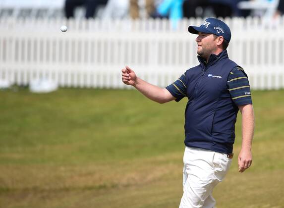22nd July 2017, Royal Birkdale Golf Club, Southport, England; The 146th Open Golf Championship, third round ; Branden Grace (RSA) throws his golf ball to his caddie after completing his historic low round of 62 in an Open Championship xDavidxBlunsdenx  ActionPlus11904865