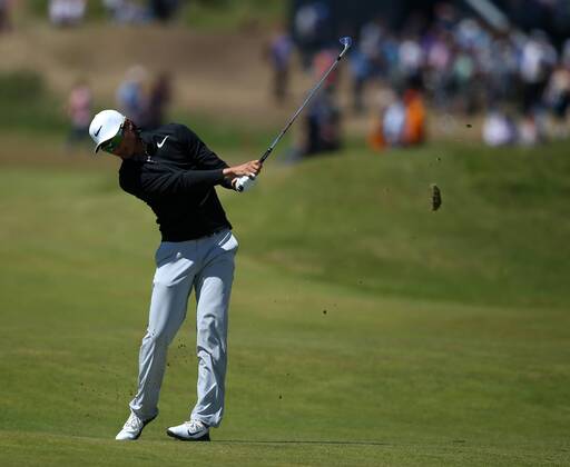23rd July 2017, Royal Birkdale Golf Club, Southport, England; The 146th Open Golf Championship, fourth round ; Haotong Li hits his approach shot from the 8th fairway xDavidxBlunsdenx  ActionPlus11905764