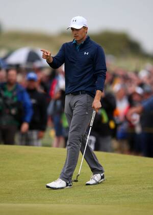 23rd July 2017, Royal Birkdale Golf Club, Southport, England; The 146th Open Golf Championship, fourth round ; Jordan Spieth (USA) raises his finger in celebration and points at the cup after holing his long putt for eagle on the 15th green xDavidxBlunsdenx  ActionPlus11905783