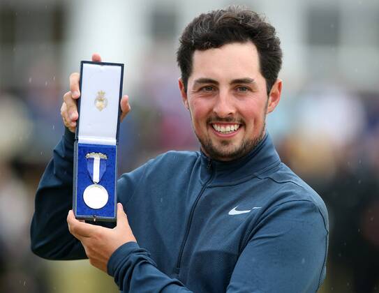 23rd July 2017, Royal Birkdale Golf Club, Southport, England; The 146th Open Golf Championship, fourth round ; Alfie Plant (amateur) (ENG) smiles as he holds the Silver Medal awarded to the highest placed amateur golfer xDavidxBlunsdenx  ActionPlus11905791
