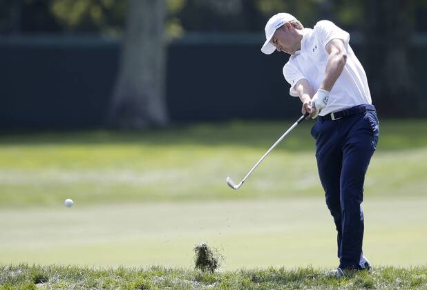Jordan Spieth hits an iron out of the rough with his approach shot to the first hole green in the final round of The Northern Trust golf championship at the Glen Oaks Club in Old Westbury, New York on August 27, 2017. Glen Oaks Club is hosting THE NORTHERN TRUST for the first time.  NYP20170827105 JOHNxANGELILLO