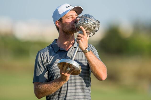 Lucas Bjerregaard kisses the Portugal Masters trophy after he won during day 4 of the European Tour - Portugal Masters 2017 at Dom Pedro Victoria Golf Course, Vilamoura, Portugal on 24 September 2017. Copyright: xMatthewxBuchanx 16770207