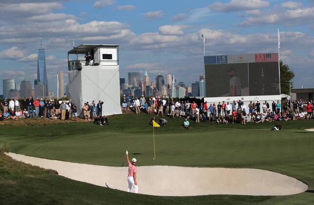 Justin Thomas of the United States reacts as his putt from the bunker on the 14th green goes in the hole on day two of the Presidents Cup on September 29, 2017 at Liberty National Golf Club in Jersey City, New Jersey.  NYP20170929502 RICHxSCHULTZ