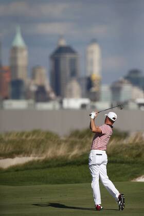 Justin Thomas of the United States hits a shot from the fairway on the 14th on day two of the Presidents Cup on September 29, 2017 at Liberty National Golf Club in Jersey City, New Jersey.  NYP20170929503 RICHxSCHULTZ