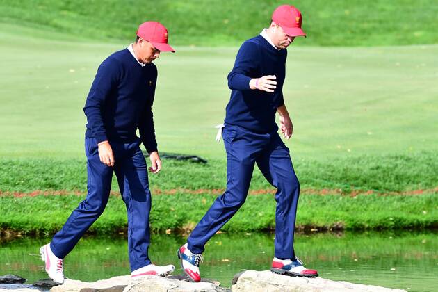 September 30, 2017 - Jersey City, New Jersey, U.S - Rickie Fowler of the US Team(left)j and Justin Thomas of the US Team(right) walk across the stone bridge after the 12th hole during Saturday matches of the Presidents Cup at Liberty National Golf Club in Jersey City, NJ GOLF 2017 - Presidents Cup - ZUMAc119 20170930_zaf_c119_004 Copyright: xBrianxCianciox