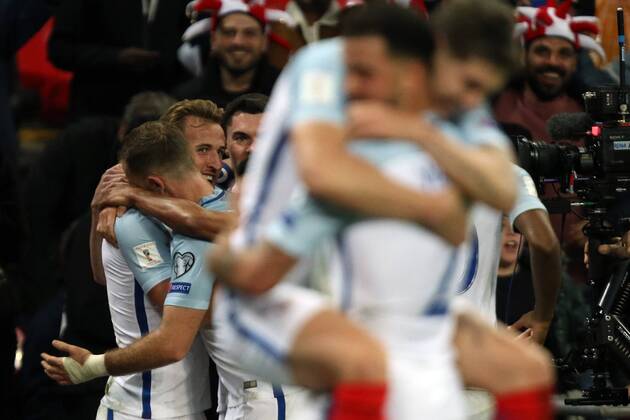 Harry Kane of England is just visible as he celebrates scoring the winning England goal, as Kyle Walker of England and Michael Keane of England celebrate in the foreground at the England v Slovenia FIFA World Cup WM Weltmeisterschaft Fussball Qualifier 2018 match at Wembley Stadium, London, on October 5, 2017. 