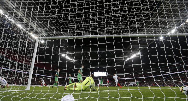 (171006) -- LONDON, Oct. 6, 2017 -- Harry Kane (R) of England scores during the FIFA World Cup WM Weltmeisterschaft Fussball 2018 European Qualifier Group E match between England and Slovenia at Wembley Stadium, in London, Britain on Oct. 5, 2017. England won 1-0. ) (SP)BRITAIN-LONDON-FOOTBALL-WORLD CUP QUALIFIER-ENGLAND VS SLOVENIA HanxYan 