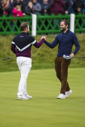 8th October 2017, Old Course, St Andrews, Scotland; Alfred Dunhill Links Championship, final round; Tyrrell Hatton congratulated upon his win by partner Jamie Dornan on the 18th green  ActionPlus11939288