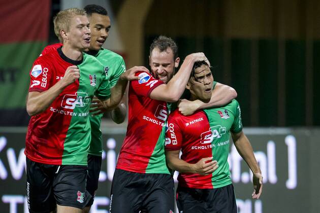 Nijmegen NEC Excelsior Football Eredivsie season 2015 2016 12 08 2015 Stadium the Goffert NEC player Navarone Foor R has the 1 0 scored NEC player Kristjan Emilsson L NEC player Jay roy cave 2L NEC player Bart Buysse 2R NEC Excelsior