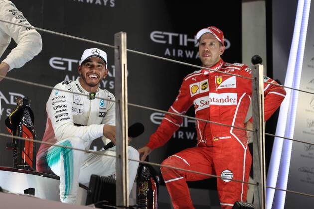 26th November 2017, Yas Marina Circuit, Abu Dhabi, UAE; Abu Dhabi Formula One Grand Prix, Sunday race day; Sebastian Vettel - Scuderia Ferrari speaks with Lewis Hamilton on the podium  ActionPlus11956634