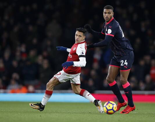 Arsenal s Alexis Sanchez tussles with Huddersfield s Steve Mounie during the premier league match at the Emirates Stadium, London. Picture date 29th November 2017. Picture credit should read: David Klein Sportimage EDITORIAL USE ONLY. No use with unauthorised audio, video, data, fixture lists, club league logos or live services. Online in-match use limited to 120 images, no video emulation. No use in betting, games or single club league player publications.