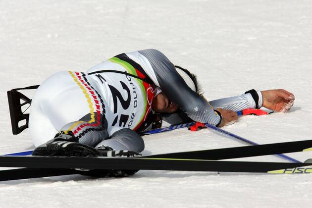Sven Fischer wins gold in the biathlon in the Sprint he is over 10 km of here exhausted at the finish in San Sicario, Italy