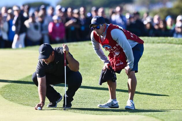 January 26, 2018 - San Diego, California, United States - Patrick Reed (L) and his caddie Kessler Karain line up a putt on the 9th green during the second round of the 2018 Farmers Insurance Open at Torrey Pines GC. Golf 2018: Farmers Insurance Open - Round 2 - ZUMAw109 20180126_zap_w109_025 Copyright: xDebbyxWongx