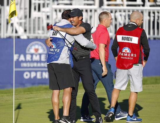 January 29, 2018 - San Diego, CA, USA - Jason Day celebrates with caddie Rika Batibasaga after winning the Farmers Insurance Open at the Torrey Pines Golf Course on January 29, 2018. Day beat Alex Noren, right, in a playoff. Farmers Insurance Open Playoff - ZUMAs44_ 20180129_zaf_s44_005 Copyright: xK.C.xAlfredx