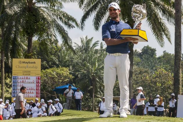 February 4, 2018 - Shah Alam, Kuala Lumpur, Malaysia - Shubhankar Sharma pro golf player from India poses with the Maybank Championship trophy after he won by the score of 21 under 267 during day four...The Maybank Championship 2018 golf event is being hosted on 1st to 4th February 2018 at Saujana Golf & Country Club. Maybank prize ceremony - ZUMAs197 81793043st Copyright: xFarisxHadziqx xSopaxImagesx