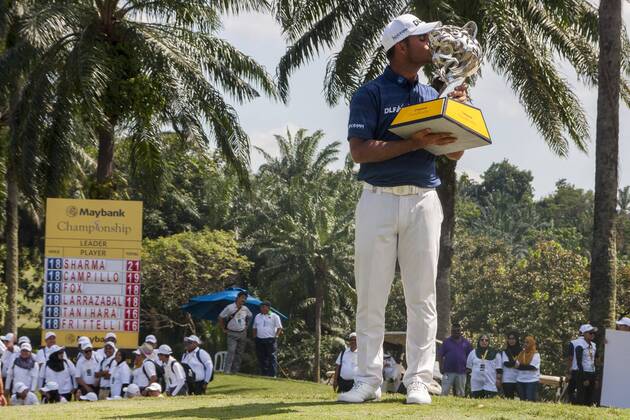 February 4, 2018 - Shah Alam, Kuala Lumpur, Malaysia - Shubhankar Sharma pro golf player from India poses with the Maybank Championship trophy after he won by the score of 21 under 267 during day four...The Maybank Championship 2018 golf event is being hosted on 1st to 4th February 2018 at Saujana Golf & Country Club. Maybank prize ceremony - ZUMAs197 81793045st Copyright: xFarisxHadziqx xSopaxImagesx
