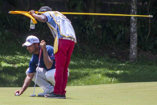 February 4, 2018 - Shah Alam, Kuala Lumpur, Malaysia - Shubhankar Sharma is seen with his caddie while he placing the ball at hole 16 on the last day of Maybank Championship 2018...The Maybank Championship 2018 golf event is being hosted on 1st to 4th February at Saujana Golf & Country Club. KL: Maybank championship last day - ZUMAs197 81794880st Copyright: xFarisxHadziqx xSopaxImagesx