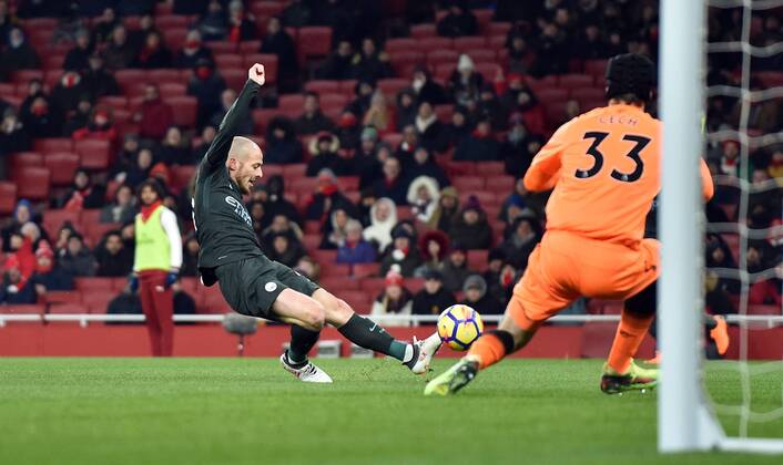 David Silva of Manchester City scores his goal to make it 2-0 past Arsenal goalkeeper Petr Cech during the Premier League match at the Emirates Stadium, London. Picture date March 1st, 2018 Pic Robin Parker Sportimage via PA Images EDITORIAL USE ONLY. No use with unauthorised audio, video, data, fixture lists, club league logos or live services. Online in-match use limited to 120 images, no video emulation. No use in betting, games or single club league player publications. DSC_3018