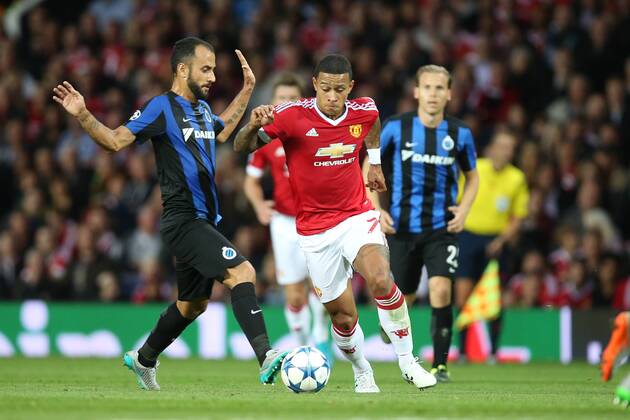 - MANCHESTER, UNITED KINGDOM: Club s Victor Vazquez Solsona and Manchester s Memphis Depay fight for the ball during a soccer game between British club Manchester United ManU FC and Belgian team Club Brugge KV in Manchester, United Kingdom, Tuesday 18 August 2015, the first leg of the play-offs for the UEFA Champions League competition. BRUNOxFAHY x84379381x