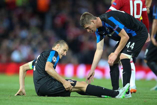 - MANCHESTER, UNITED KINGDOM: Club s Timmy Simons lies injured on the ground during a soccer game between British club Manchester United ManU FC and Belgian team Club Brugge KV in Manchester, United Kingdom, Tuesday 18 August 2015, the first leg of the play-offs for the UEFA Champions League competition. BRUNOxFAHY x84379391x