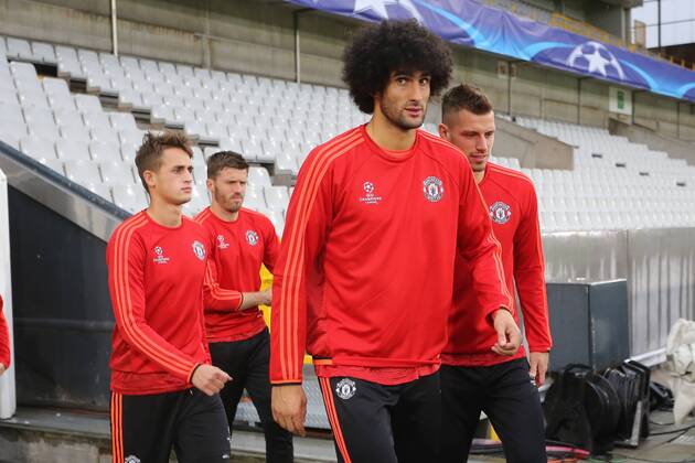 - BRUGGE, BELGIUM: Manchester s Adnan Januzaj and Manchester s Marouane Fellaini arrive for a training session of British soccer club Manchester United ManU in Brugge, Tuesday 25 August 2015. Tomorrow Belgian first league soccer team Club Brugge will play the return game of the play-offs of the Uefa Champions League competition against British soccer club Manchester United FC. Manchester United won the first leg 3-1. BRUNOxFAHY  x84611100x