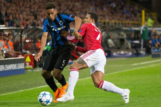 - BRUGGE, BELGIUM: Club s Jean-Charles Castelletto and Manchester s Memphis Depay fight for the ball during a soccer game between Belgian first league team Club Brugge KV and British club Manchester United ManU FC in Brugge, Wednesday 26 August 2015, the return game of the play-offs of the UEFA Champions League competition. Manchester United won the first leg 3-1. KURTxDESPLENTER x84637856x