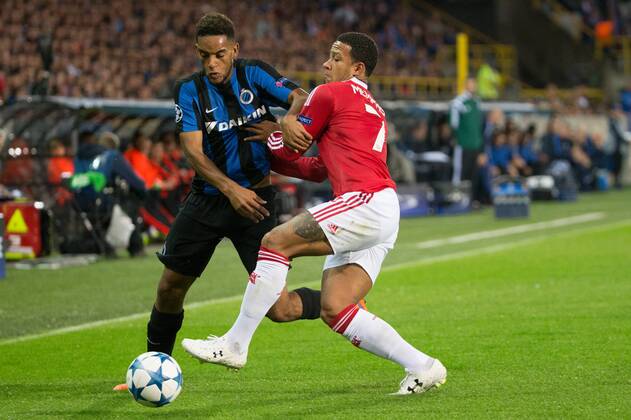 - BRUGGE, BELGIUM: Club s Jean-Charles Castelletto and Manchester s Memphis Depay fight for the ball during a soccer game between Belgian first league team Club Brugge KV and British club Manchester United ManU FC in Brugge, Wednesday 26 August 2015, the return game of the play-offs of the UEFA Champions League competition. Manchester United won the first leg 3-1. KURTxDESPLENTER x84637874x