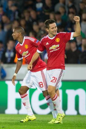 - BRUGGE, BELGIUM: Manchester s Ander Herrera (R) celebrates with his teammate Ashley Young after scoring during a soccer game between Belgian first league team Club Brugge KV and British club Manchester United ManU FC in Brugge, Wednesday 26 August 2015, the return game of the play-offs of the UEFA Champions League competition. Manchester United won the first leg 3-1. KURTxDESPLENTER  x84639072x