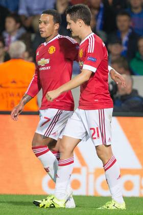 - BRUGGE, BELGIUM: Manchester s Ander Herrera (R) celebrates with his teammate Memphis Depay after scoring during a soccer game between Belgian first league team Club Brugge KV and British club Manchester United ManU FC in Brugge, Wednesday 26 August 2015, the return game of the play-offs of the UEFA Champions League competition. Manchester United won the first leg 3-1. KURTxDESPLENTER  x84639074x