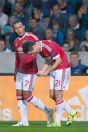 - BRUGGE, BELGIUM: Manchester s Ander Herrera (R) celebrates with his teammate Memphis Depay after scoring during a soccer game between Belgian first league team Club Brugge KV and British club Manchester United ManU FC in Brugge, Wednesday 26 August 2015, the return game of the play-offs of the UEFA Champions League competition. Manchester United won the first leg 3-1. KURTxDESPLENTER  x84639108x