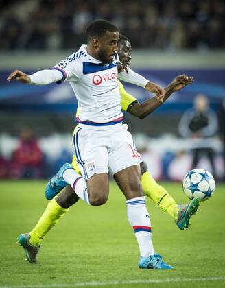 - GENT, BELGIUM: Lyon s Alexandre Lacazette and Gent s Nana Asare fight for the ball during the first game in the group stage of the Uefa Champions League competition, in group H, between Belgian first league soccer team KAA Gent and Olympique Lyon, in Gent, Wednesday 16 September 2015. JASPERxJACOBS x85282462x