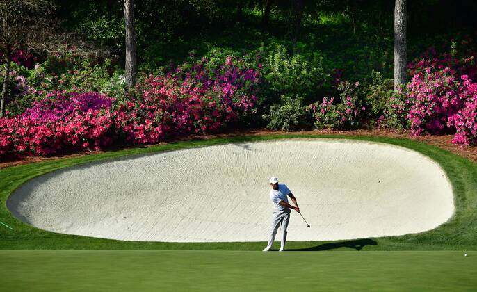 Tiger Woods chips on the 14th green during a practice round prior to the Masters golf tournament at the Augusta National Golf Club, on April 3, 2018 in Augusta, Georgia.  AUG20180403324 KEVINxDIETSCH