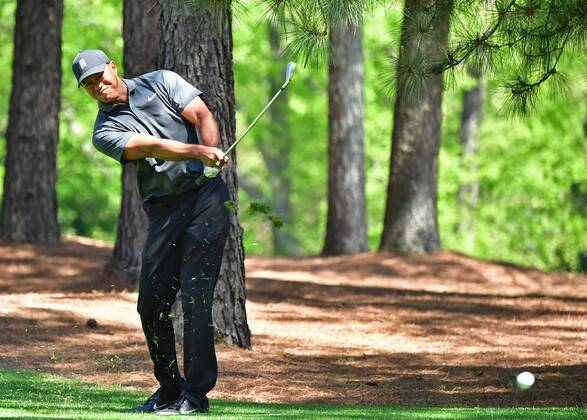 Tiger Woods hit from the rough on the 11th hole during the first round of the 2018 Masters Tournament at the Augusta National Golf Club in Augusta, Georgia, on April 5, 2018.  AUG20180405355 KEVINxDIETSCH