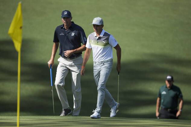 Matt Kuchar (L), Rickie Fowler (C) and Phil Mickelson walk onto the 10th green during the first round of the 2018 Masters Tournament at the Augusta National Golf Club in Augusta, Georgia, on April 5, 2018.  AUG20180405371 KEVINxDIETSCH