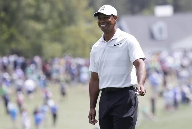Tiger Woods smiles on the first hole fairway after his tee shot in the 2nd round of the 2018 Masters Tournament at the Augusta National Golf Club in Augusta, Georgia, on April 6, 2018.  AUG20180406121 JOHNxANGELILLO