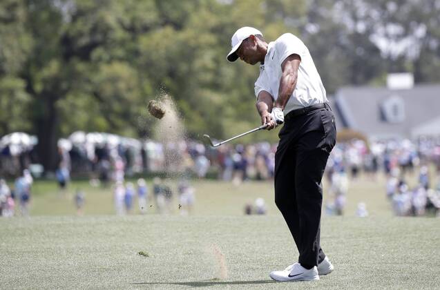 Tiger Woods hits his approach shot on there first hole in the 2nd round of the 2018 Masters Tournament at the Augusta National Golf Club in Augusta, Georgia, on April 6, 2018.  AUG20180406123 JOHNxANGELILLO