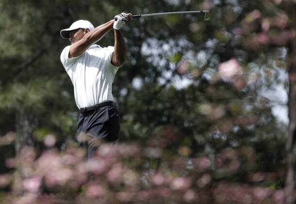 Tiger Woods hits an iron from the second hole fairway in the 2nd round of the 2018 Masters Tournament at the Augusta National Golf Club in Augusta, Georgia, on April 6, 2018.  AUG20180406131 JOHNxANGELILLO