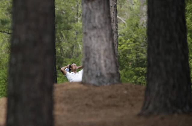 Tiger Woods reacts before hitting his approach shot to the 11th green in the 2nd round of the 2018 Masters Tournament at the Augusta National Golf Club in Augusta, Georgia, on April 6, 2018.  AUG20180406141 JOHNxANGELILLO